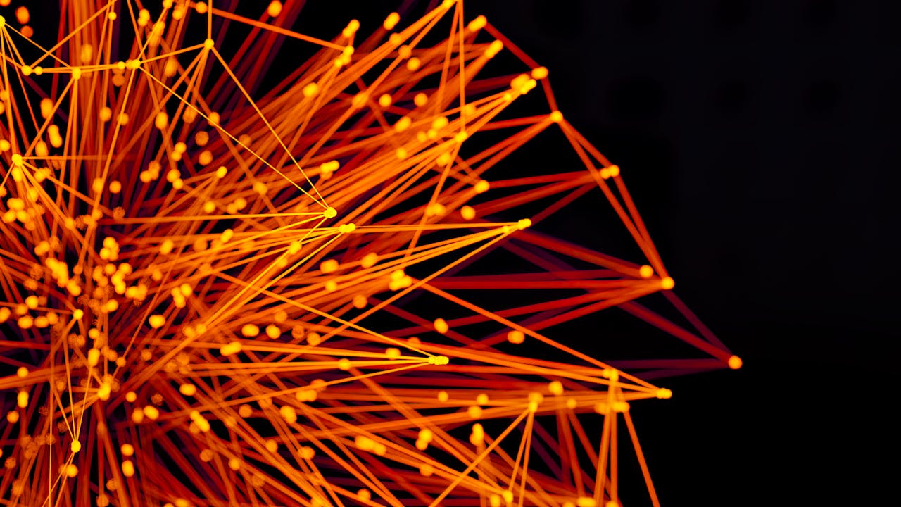 services-01 Vibrant orange lines and dots form an abstract network on a dark background, evoking technology and connectivity.